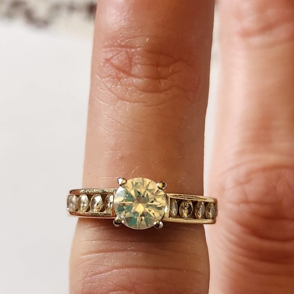 Gold Jewelry - 14k gold + Moissanite (a popular diamond simulant)
 sz 6 ring, engagement style
